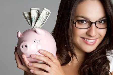 Girl Holding Piggy Bank